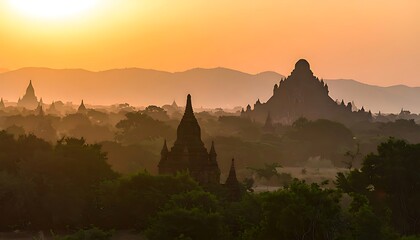 Sunrise silhouettes of ancient temples in a misty landscape.