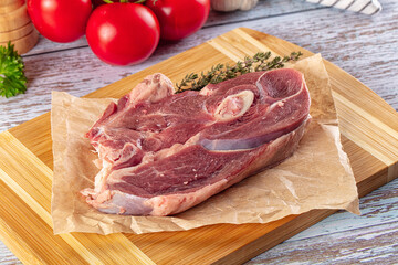 Raw lamb steak with bone