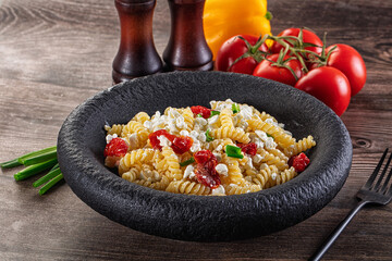 Italian pasta fusili with curd
