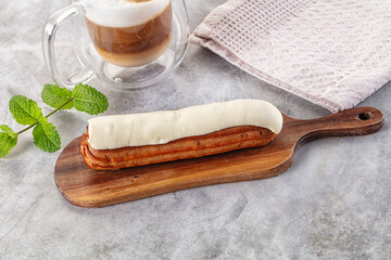 White vanilla eclair with icing