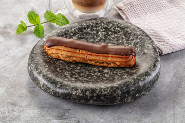 Gourmet chocolate eclair with icing