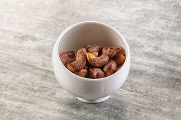 Unpeeled cashew nuts in the bowl