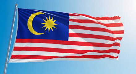 Waving Flag of Malaysia Against Blue Sky