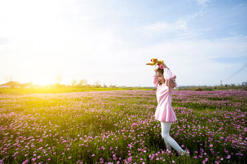 The little Asian girl playing in the garden