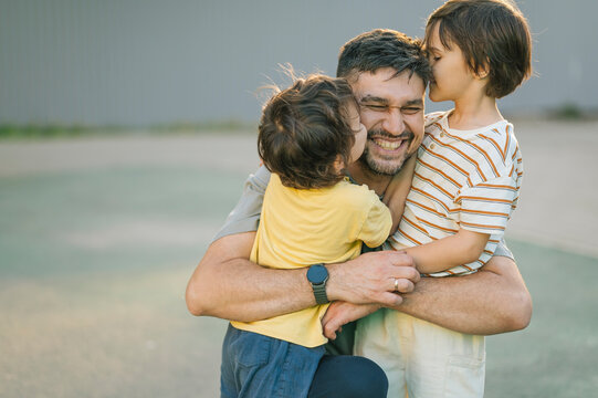 Father and son hugging outdoors showing unconditional love