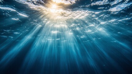 Obraz premium Sunlight Rays Through Water Surface Creating Serene Ocean Depths