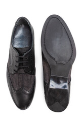 Pair of Stylish Classic Formal Male Black Polished Derby Leather Laced Shoes Placed Together Over White.