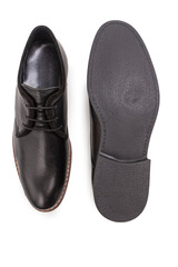Footwear Concepts. One Pair of Stylish Classic Formal Male Black Polished Derby Leather Laced Shoes Placed Together Over White.