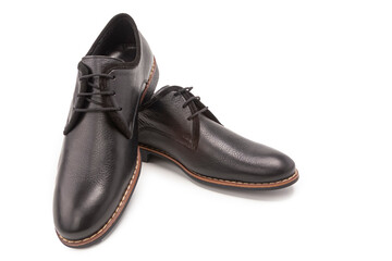 Footwear Concepts. One Pair of Stylish Classic Formal Male Black Calf Leather Derby Laced Shoes Placed Together Over White.