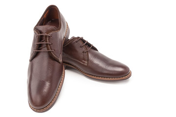 Footwear Concepts. One Pair of Stylish Classic Formal Male Brown Calf Leather Derby Laced Shoes Placed Together Over White.