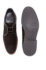 Mens Footwear Concepts. One Pair of Stylish Classic Formal Male Dark Brown Suede Chukka Boots Shoes Placed Together Over White.