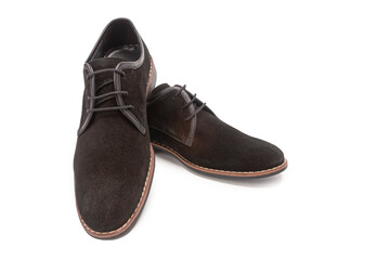 Pair of Stylish Classic Male Dark Brown Suede Leather Derby Desert Boots Shoes Placed Together On One Another Over White.
