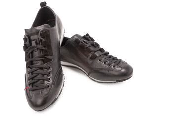 Pair of Stylish Sportive Male Black Leather Sneakers Boots Shoes Placed Together On One Another...