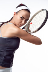 Sport And Lifestyle Concepts. Young Caucasuan Sporty Fit Woman in Tennis Outfit Posing With Tennis Racket Preparing to Serve Ball Over White