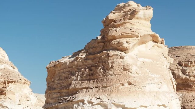 White rock formations and sand dunes in Egypt's White Desert, a natural desert landscape	