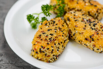 Vegetarian cutlets in a white plate on a gray concrete background macro photo