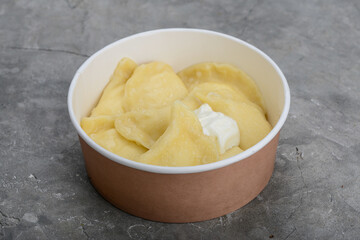 Potato dumplings in a disposable container