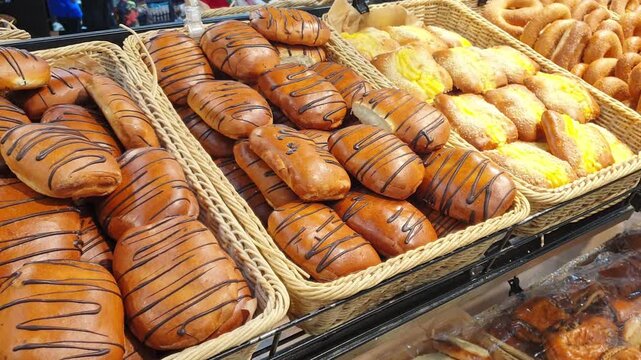 Footage of the various bread products in the bakery shop. Food