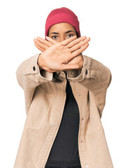 Young Filipino woman in studio doing a denial gesture