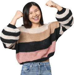 Young Chinese woman raising fist after a victory, winner concept.