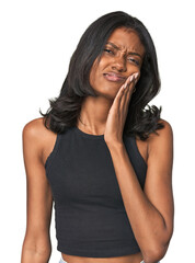 Portrait of a young Indian woman having a strong teeth pain, molar ache.
