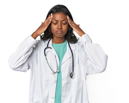 Young Indian doctor with stethoscope touching temples and having headache.