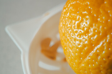 Details of lemon peel, strainer in background
