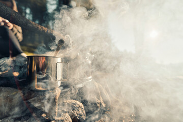 Mug and smoke from a fire