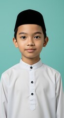 Obraz premium Portrait of a Young Muslim Boy in Traditional Attire