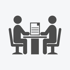 Gray Icon of Two Figures Seated at Table with on White Background