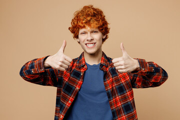 Young smiling redhead man he wear red shirt blue t-shirt casual clothes showing thumb up like...