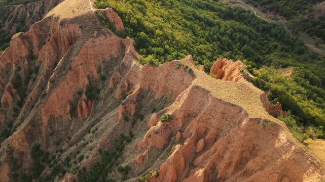 Drone flight over the sandstone peaks of the Stob Pyramids Bulgaria unique natural landmark with scenic countryside.