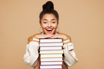 Young surprised happy smart girl student wears casual clothes backpack bag hold stack of many paper...