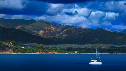 Sailboat landscape along the Corsican coast in France
