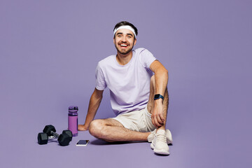 Full body young smiling fun strong fitness trainer instructor sporty man sportsman wear sportswear...