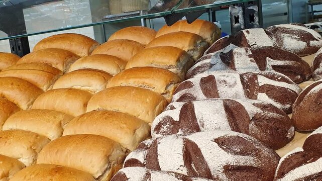 Footage of the various bread products in the bakery shop. Food