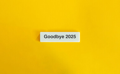 Goodbye 2025 text on letter tile with yellow background in minimal design