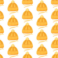 Seamless pattern with yellow kids knitted hat. Autumn background with yarn headwear. Vector ornament