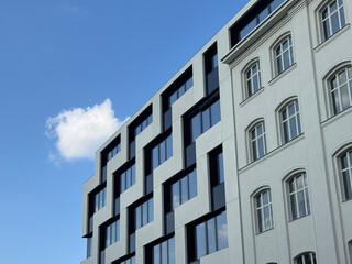 Modern and Historic Building Facades under Blue Sky