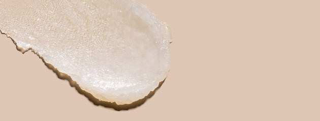 sample smear of cosmetic peeling on a beige background close-up