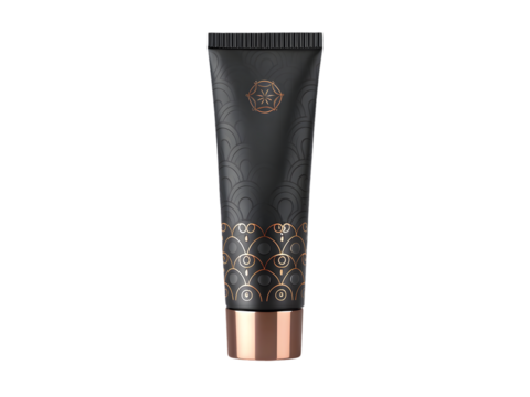 Matte black cosmetic tube with gold art deco pattern and copper cap isolated on a transparent background