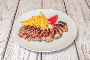 Grilled white veal from Asturias, with baked potatoes cooked in a clay pot