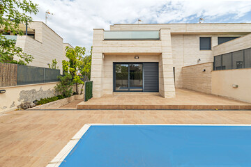 Interior garden designed as an extension of the living spaces, with natural stone paths surrounding...