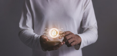 Young man using smartphone hand touching to trade cryptocurrencies online, Investors in cryptocurrencies and bitcoin coins online