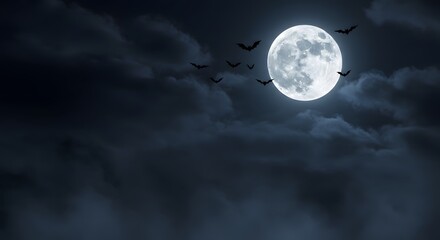 Naklejka premium Full moon shrouded in clouds, bats silhouetted against its bright light, nighttime scene.