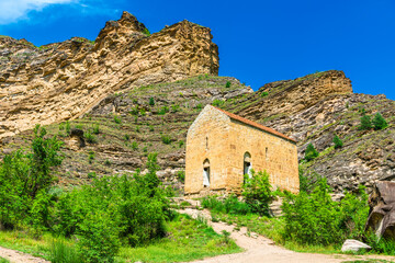 Fototapeta premium Ancient Datun temple among picturesque rocks in the mountains of Dagestan. North Caucasus
