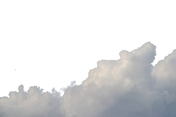 Beautiful, fluffy clouds float through the bright blue sky above the city