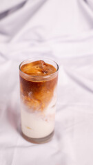 Iced coffee latte isolated from white background. Perfect for recipe, article, catalogue, promotion, or any cooking contents