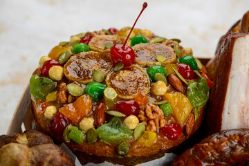 basket with Easter sausages, meat and goodies on a macro photo background