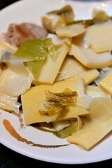 Traditional Taiwanese pickled cabbage with bamboo shoots, popular home-style dish combining sour pickled vegetables with tender bamboo shoots.
